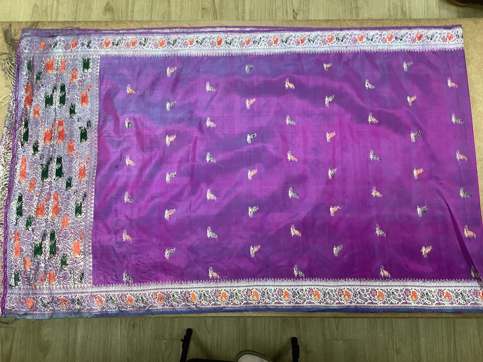 A Chinese embroidered silk panel of a phoenix, 84.5 x 54 cm, an Indian silk panel and a metal beadwork purse